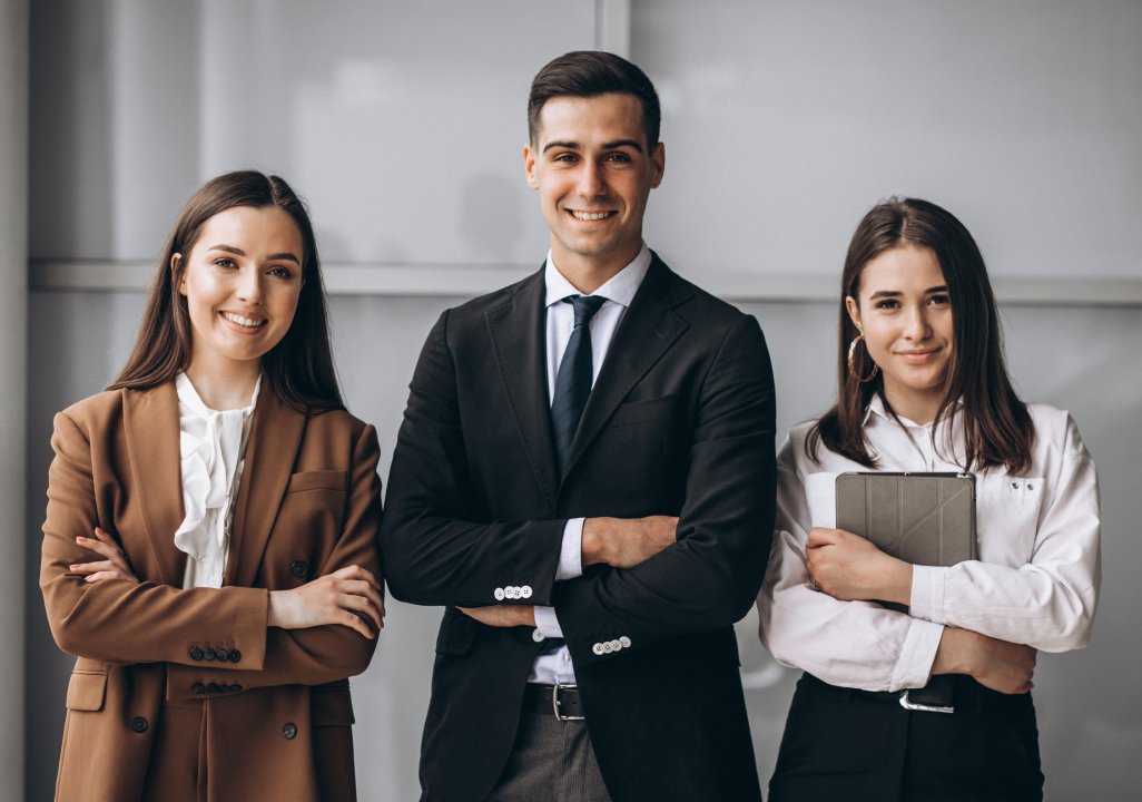 A group of people posing for a photograph during a corporate event.