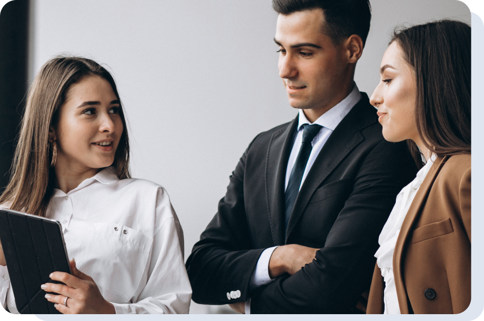 A group of business people looking at a tablet.